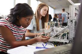 Two female students working on a science experiment Two female students working on a science experiment